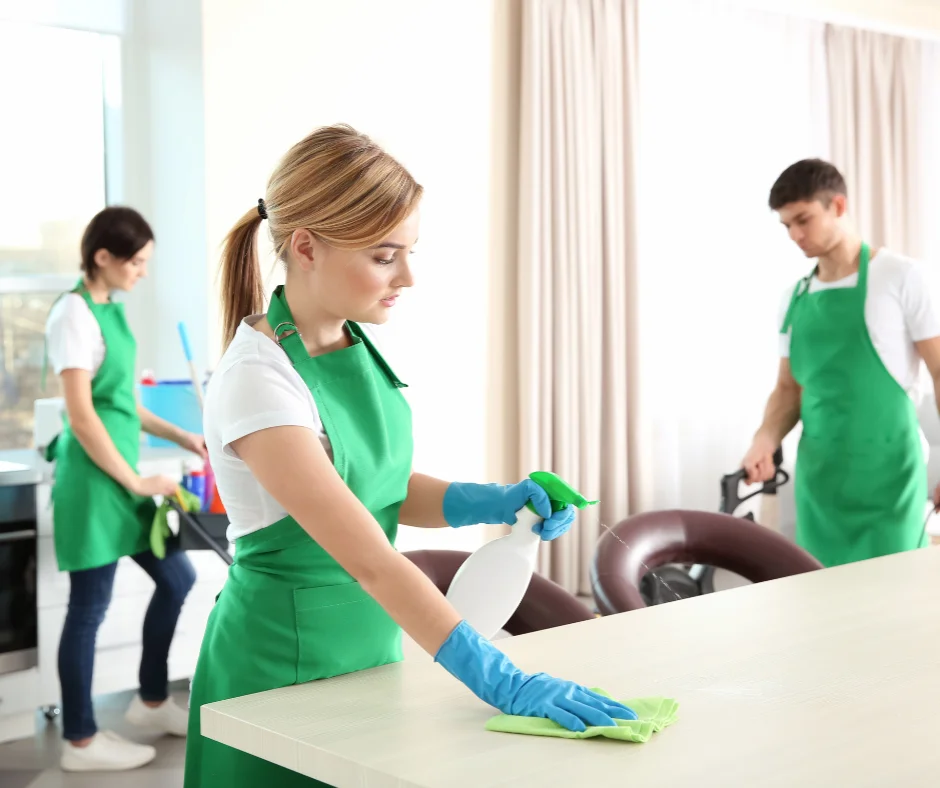 Jiffy Elite Maids professionals cleaning a modern home in Cooper City, Florida—disinfecting surfaces, vacuuming carpets, and using pet-safe products for a spotless finish.